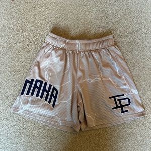 Inaka Power Cream and purple lightning shorts size medium